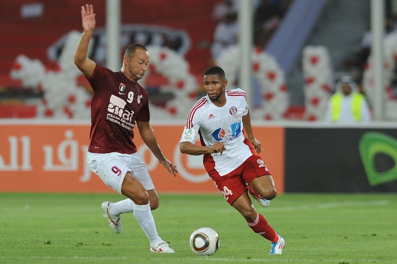 (left) Fernando Baiano of Al Wahda defends against Al Jazira's #24 Subait Khater at a recent match.  Al Ittihad