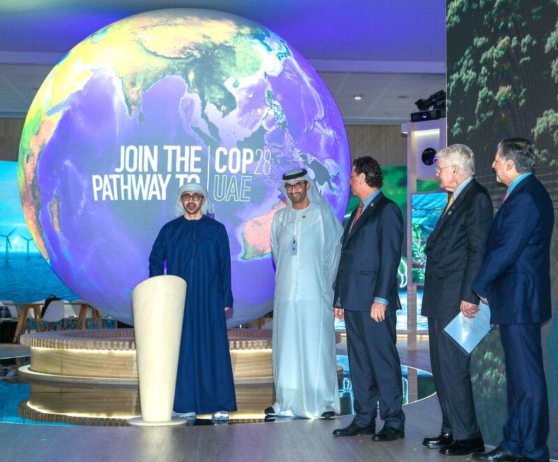 Sheikh Abdullah bin Zayed, Minister of Foreign Affairs and International Co-operation, unveils the Cop28 logo with President-designate Dr Sultan Al Jaber, Minister of Industry and Advanced Technology, at Abu Dhabi Sustainability Week. Victor Besa / The National