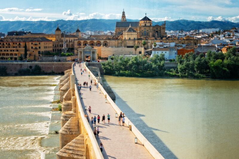 Cordoba Roman Bridge crossing Guadalquivir River and Cordoba Mosque Cathedral in the background in Spain (Getty Images) *** Local Caption ***  wk08ap-tr-mkop-cordoba.jpg