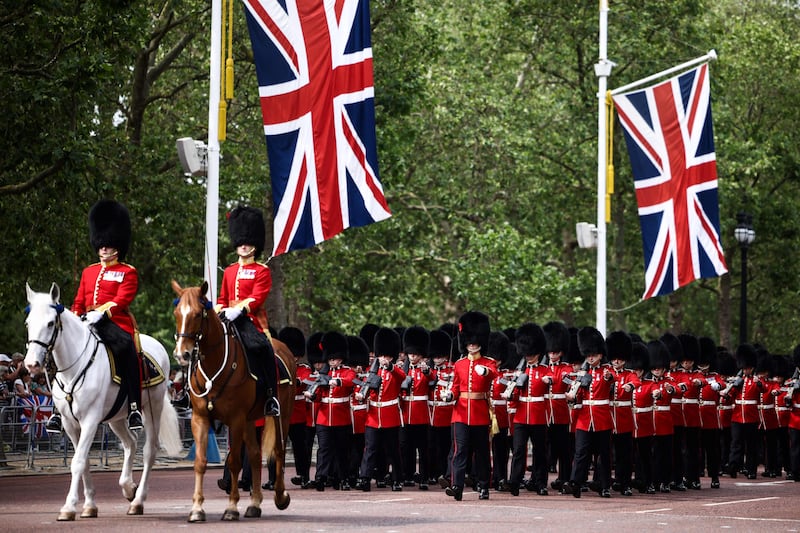Coldstream Guards, a regiment of the Household Division Foot Guards, parade down The Mall. AFP