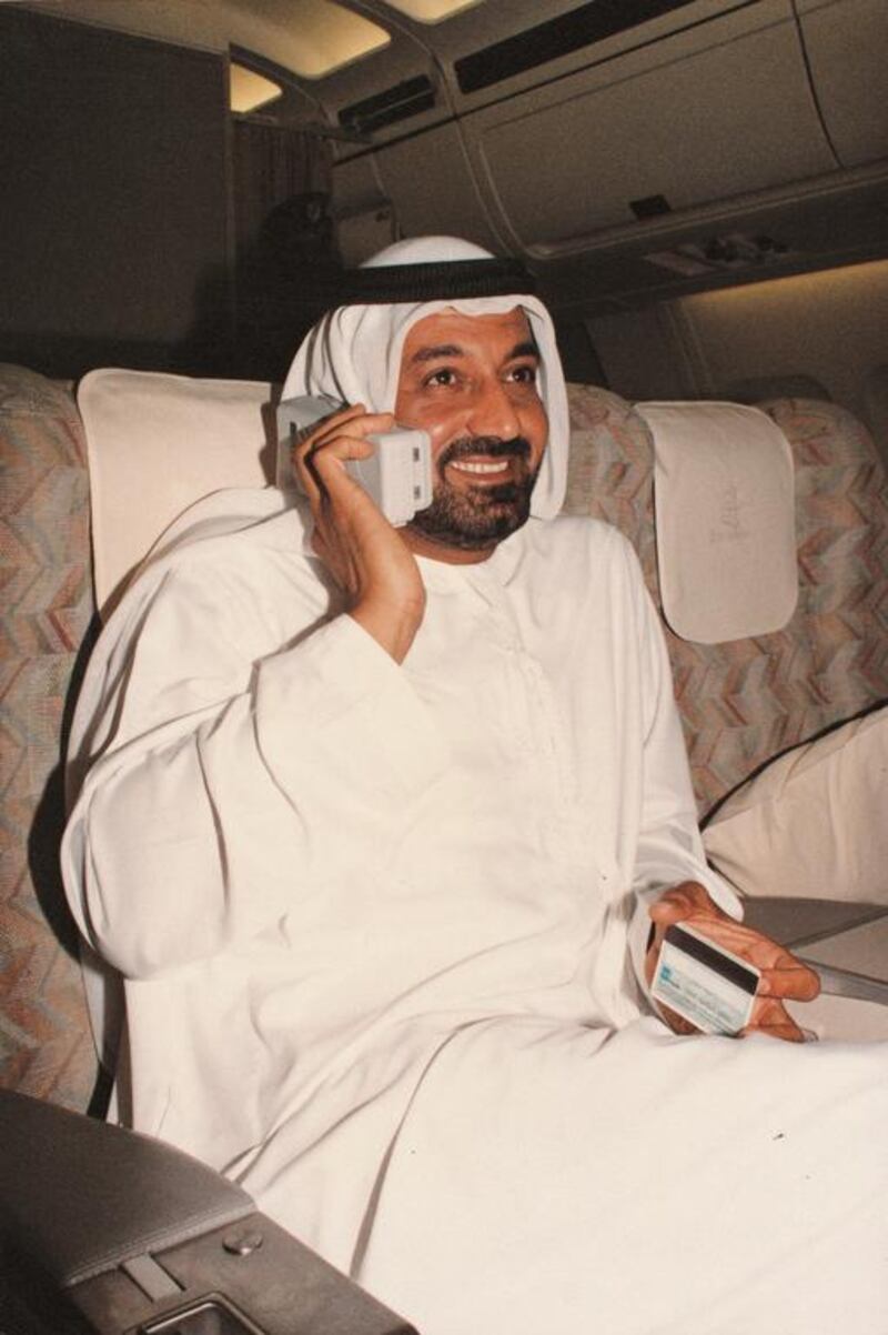 Sheikh Ahmed holds a phone onboard an Emirates flight in 1993. In 1992, Emirates became the first airline to install video systems in all seats in all classes throughout its Airbus fleet. In the same year it started flights to Charles de Gaulle in Paris and opened an exclusive Emirates terminal at Dubai International Airport. It also became the first airline to order a $20 million Airbus full-flight simulator. In 1993 it became the first airline to introduce telecommunications on all of its Airbus aircraft – in all three classes. The following year it was the first airline to equip an Airbus fleet with an on-flight fax facility. Courtesy Emirates