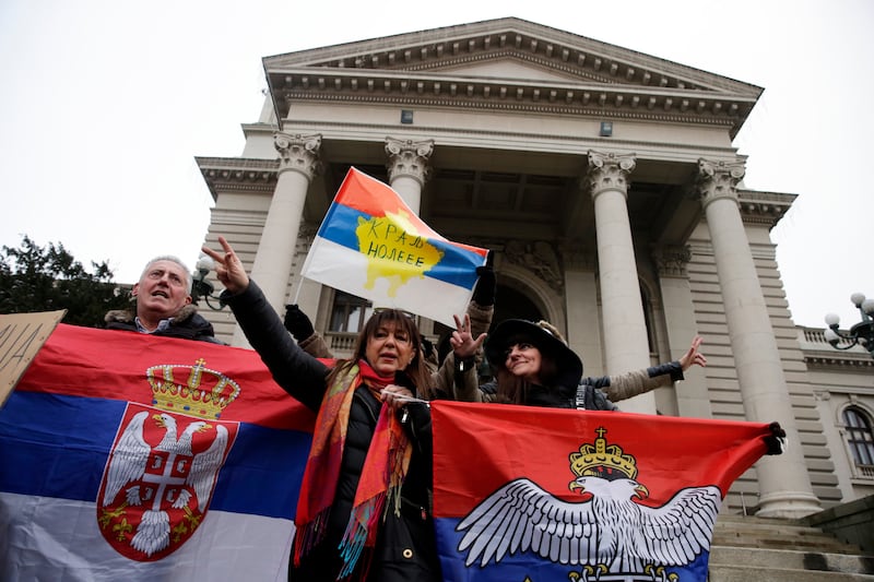 Supporters of Serbian tennis player Novak Djokovic hold Serbian flags during a protest of support in Belgrade. EPA