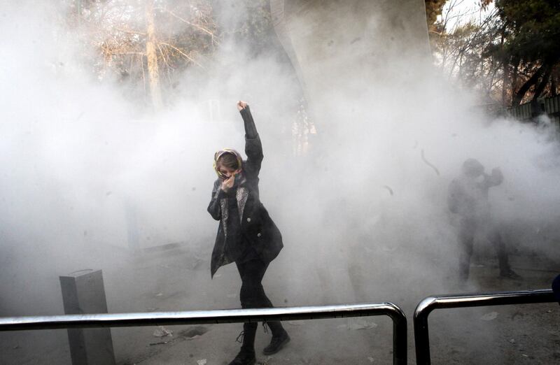 epaselect epa06410380 Iranian students clash with riot police during an anti-government protest around the University of Tehran, Iran, 30 December 2017. Media reported that illegal protest against the government is going on in most of the cities in Iran. Protests were held in at least nine cities, including Tehran, against the economic and foreign policy of President Hassan Rouhani's government.  EPA/STR