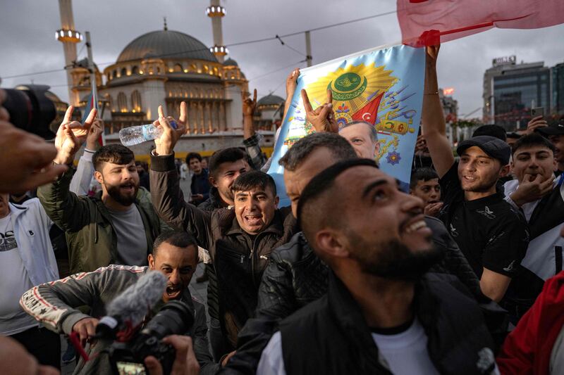 Mr Erdogan's supporters celebrate near Taksim Mosque in Istanbul. AFP