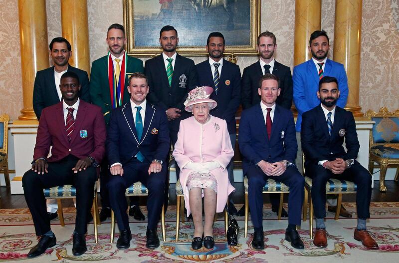 Queen Elizabeth II sits with the 10 captains of the sides competing at the Cricket World Cup 2019. AP Photo