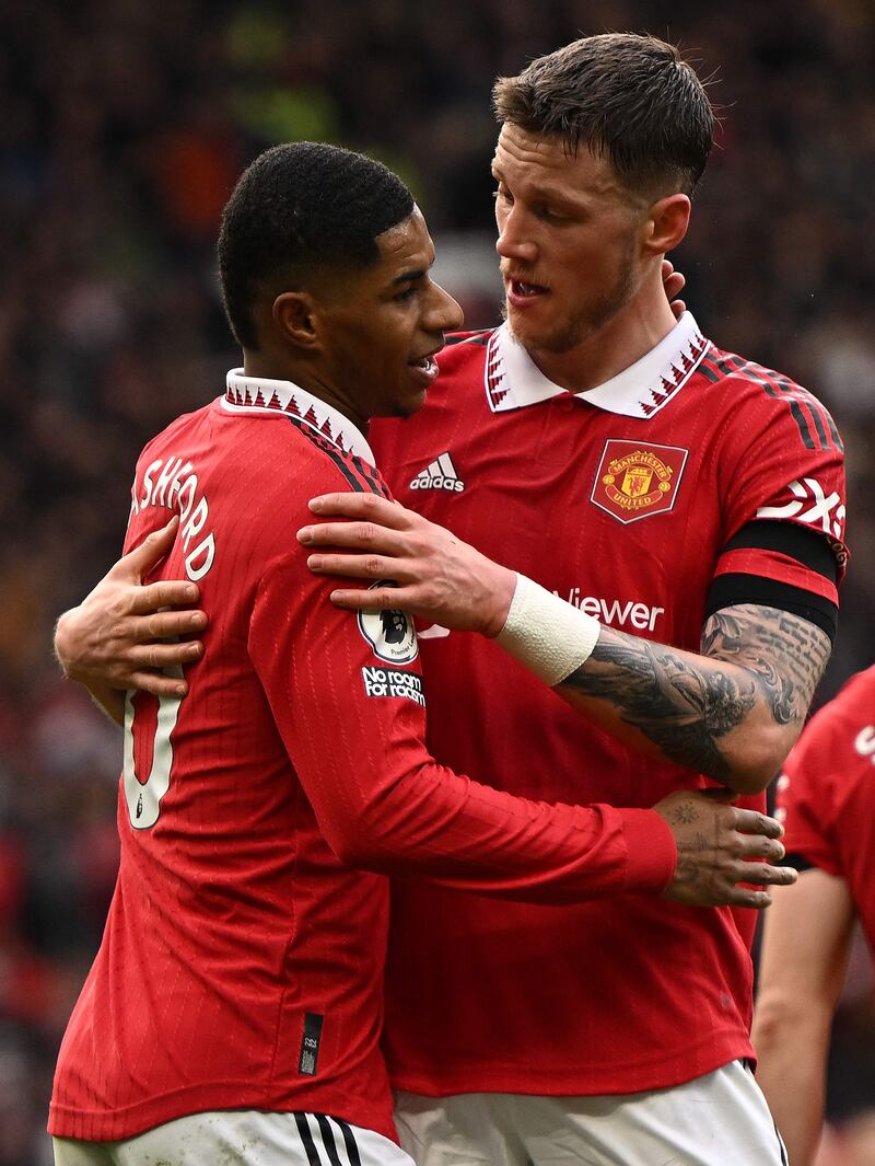 Manchester United's Marcus Rashford celebrates scoring the opening goal against Leicester with Wout Weghorst. AFP