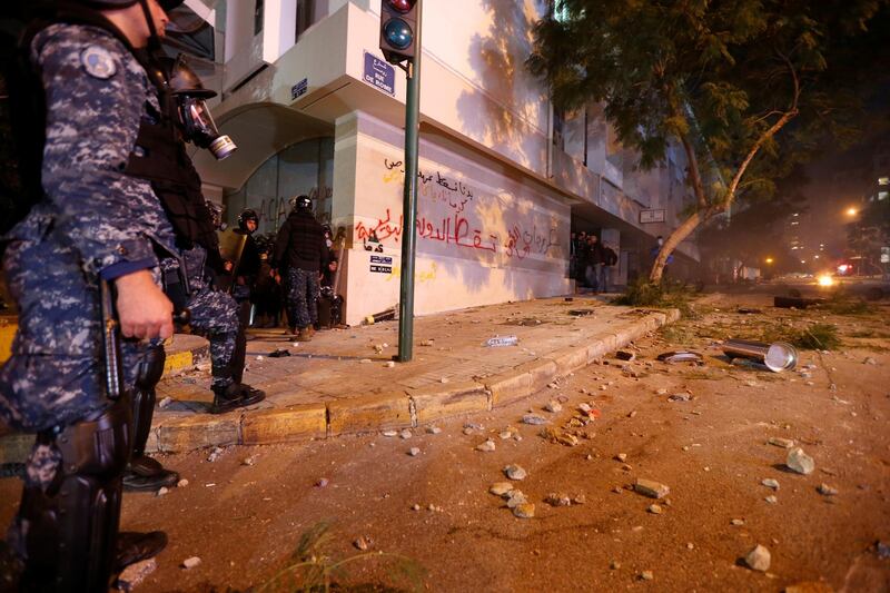 Police keep watch along a street as protests against the government continue in Beirut, Lebanon. Reuters