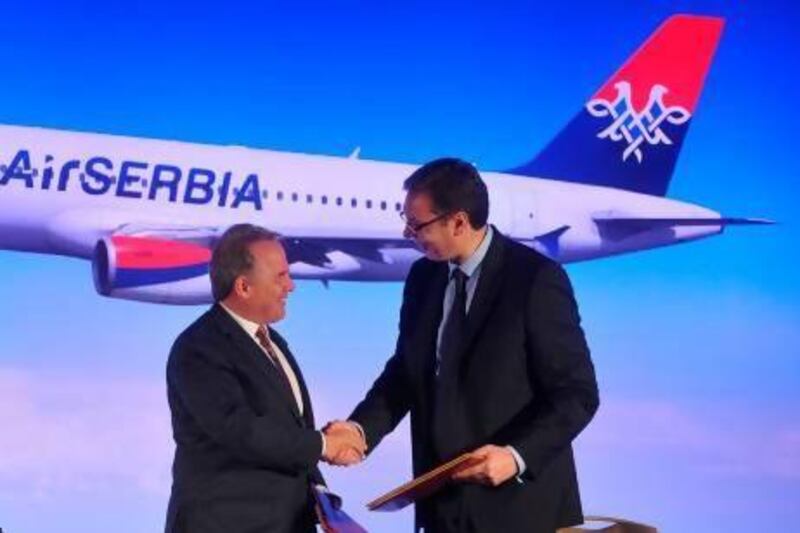 Aleksandar Vucic, the deputy prime minister of Serbia, right, and James Hogan, the chief executive of Etihad Airways during the signing of the partnership agreement between Jat Airways and Etihad in Belgrade. Andrej Isakovic / AFP