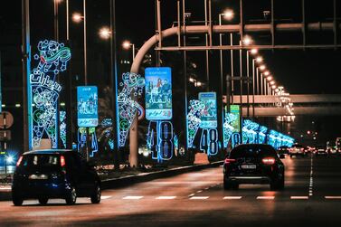 National Day decorations are lit up across downtown Abu Dhabi. Victor Besa / The National 