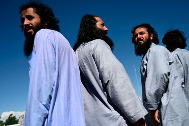 Taliban prisoners wait to be released from the Bagram prison, next to the US military base in Bagram on May 26. AFP