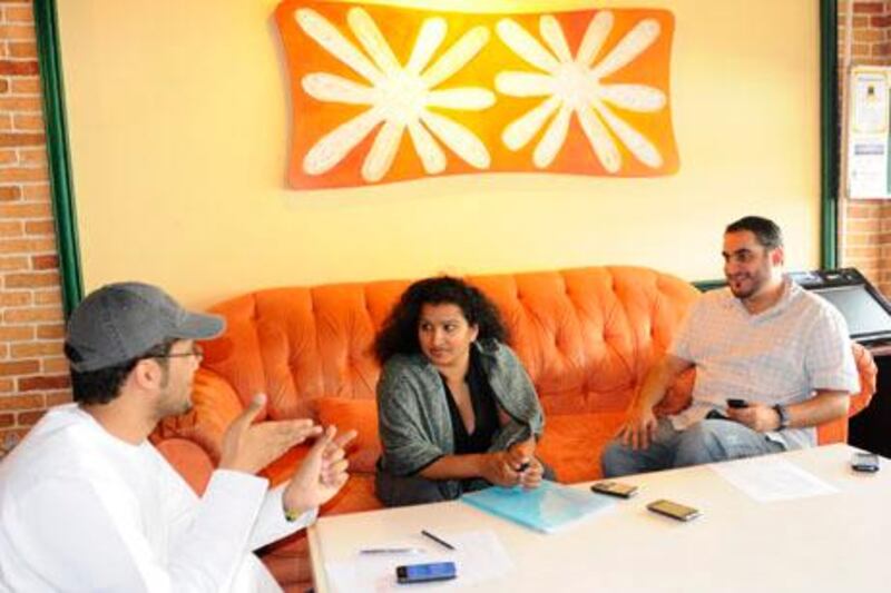 Saro Carlwig(C), founder/Agent of Talent Casting Agency(TCA), with two new writers, Ahmed Arshi(R) and Khaled Al Jabri(L),  she just signed up to TCA on Saturday, March 05, 2011 in Dubai, United Arab Emirates.  Photo: Charles Crowell for The National