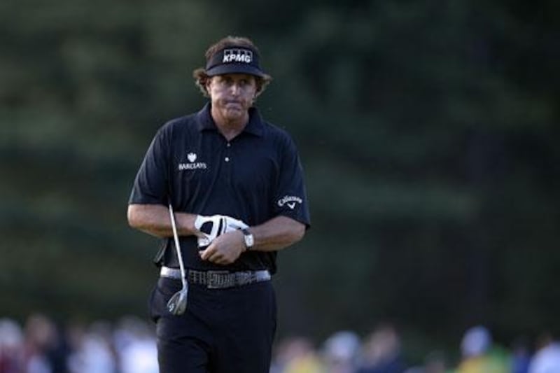Phil Mickelson reacts to a missed chip into the 18th hole during the fourth round of the US Open. Brendan Smialowski / AFP