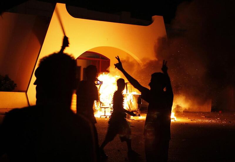Benghazi residents set fire to the headquarters of Ansar Al Sharia on September 21, 2012, days after a deadly attack on the US consulate in the city that was blamed on the Libyan extremist group. Asmaa Waguih / Reuters