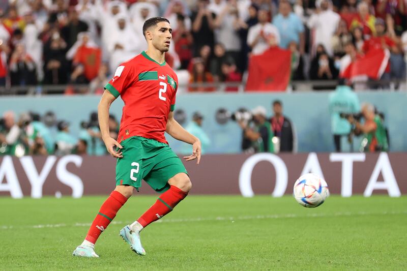 Achraf Hakimi of Morocco scores the team's fourth and winning penalty in the shoot-out against Spain. Getty 