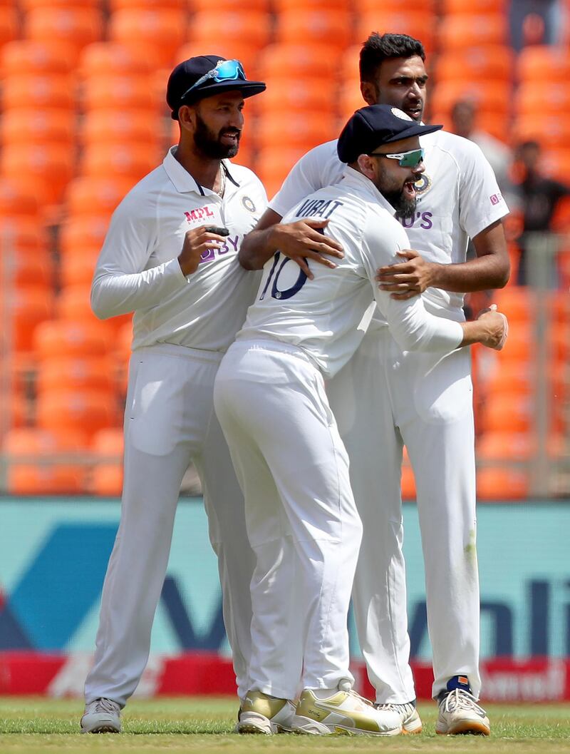 India's captain Virat Kohli, centre, congratulates Ravichandran Ashwin, right, after dismissing England's Zak Crawley during the third day of fourth Test at the Narendra Modi Stadium in Ahmedabad on Saturday, March 6, 2021. India won the Test by by an innings and 25 runs and the series 3-1. AP