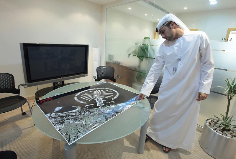 Salem Humaid Al Marri, the assistant director general for scientific and technical affairs, Emirates Institution for Advance Science and Technology, with the new imagery completed by Dubai Sat 2. Jeffrey Biteng / The National