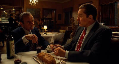 This image released by Netflix shows Joe Pesci, left, and Robert De Niro in a scene from "The Irishman." The film is nominated for a Golden Globe for best motion picture drama. (Netflix via AP)