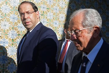 Tunisian Prime Minister Youssef Chahed, left, with former parliament president Mohamed Ennaceur who was sworn in as Interim president on July 25, 2019. AFP