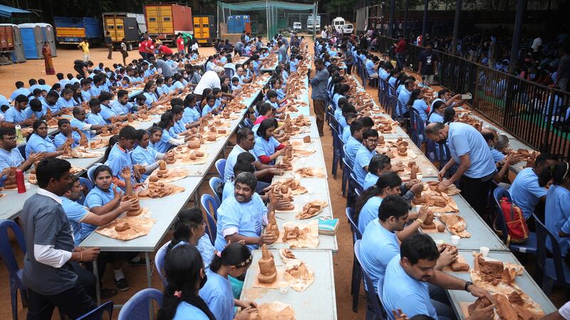 More than 3,300 people set a new Guinness World Record for 'the most people sculpting with modelling clay' in Bangalore, India, creating busts of the elephant-headed Hindu God Ganesha. EPA