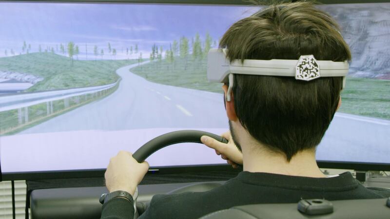 Nissan uncovered its “brain-to-vehicle” project at CES. A headset measuring brainwaves can use this information to predict a driver's movements.