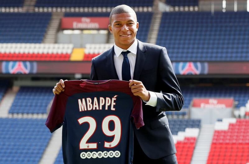 Soccer Football - Paris St Germain - Kylian Mbappe Press Conference - Paris, France - September 6, 2017. New Paris St Germain signing Kylian Mbappe poses with the club shirt after a press conference.    REUTERS/Gonzalo Fuentes     TPX IMAGES OF THE DAY