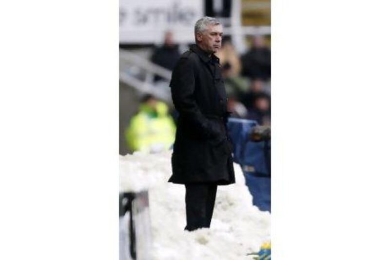 Carlo Ancelotti watches yesterday’s game at St James’ Park from a snowy vantage point on the sidelines.