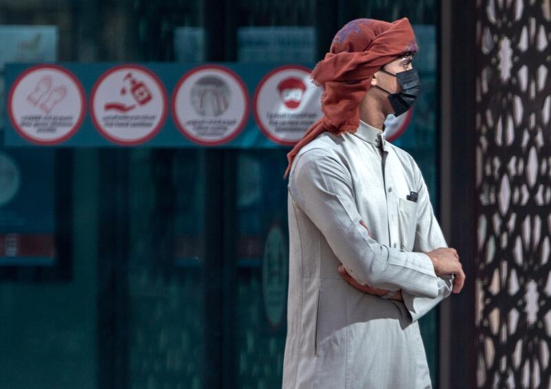 An Abu Dhabi resident waits for his bus at central Abu Dhabi on May 19th, 2021. Victor Besa / The National.
For: Stand Alone / Stock Images