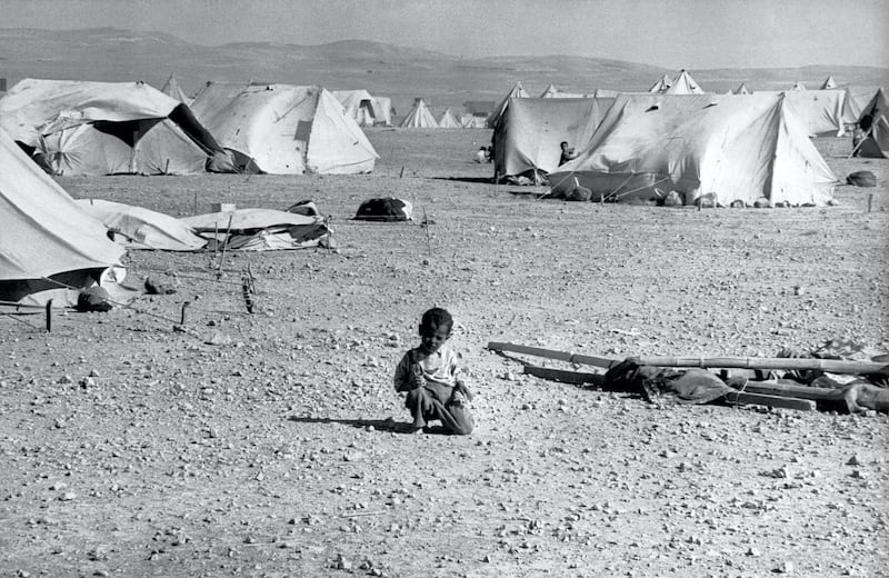 A Palestinian child plays 23 June 1967 in a refugee camp in Jordan. The June 1967 war was a stunning military victory for Israel, but the start of a political stalemate that continues to this day. During the Six-Day War Israel suffered around 700 fatalities, while estimates of the numbers of Arabs killed range from just over 11,000 to 21,000, with losing the Egyptians paying the heaviest tribute. Israel was left in control of the Sinai, the Gaza Strip, the West Bank and East Jerusalem and the Golan Heights. Some 350,000 Palestinians fled the newly occupied regions to take up residence in neighbouring states. Most of them have never been able to return, and are still living in refugee camps. (Photo by AFP)