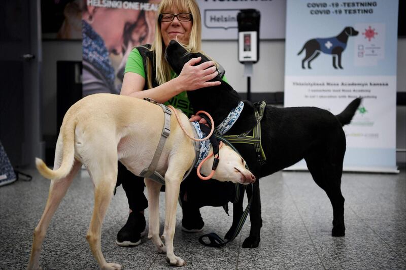 Kössi and Miina greet trainer Susanna Paavilainen at the airport. AFP