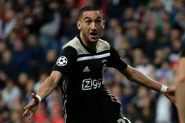 FILE - In this Tuesday, March 5, 2019 file photo, Ajax's Hakim Ziyech celebrates scoring the opening goal during their Champions League soccer match against Real Madrid at the Santiago Bernabeu stadium in Madrid, Spain. Chelsea agreed to sign winger Hakim Ziyech from Ajax at the end of the season on Thursday, Feb. 13, 2020 for 40 million euros ($43 million). Ajax said the Morocco winger will join Chelsea on July 1 after finishing the season. (AP Photo/Manu Fernandez, file)