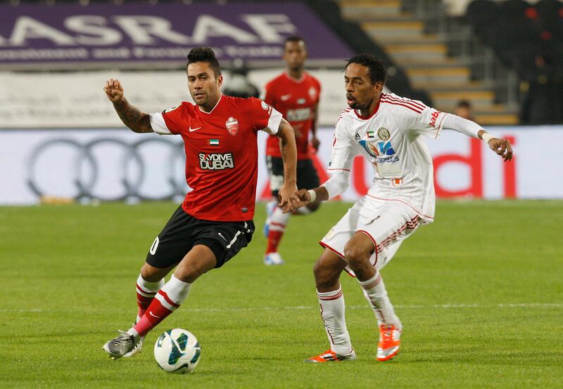 Abu Dhabi, United Arab Emirates , Jan 26 2013, Al Jazira v Al Ahli- (left) Al Ahli's #10 Luis Antonio Jiminez works the ball freei . Mike Young / The NationaL