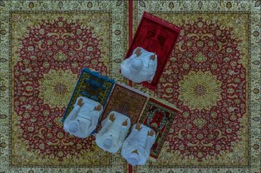 This picture was shot in Al Ain City, in the UAE. It shows three members of the same family performing the Al Asr prayer at home, following the closure of mosques, due to the pandemic. Photo by Salem Sarhan, United Arab Emirates.