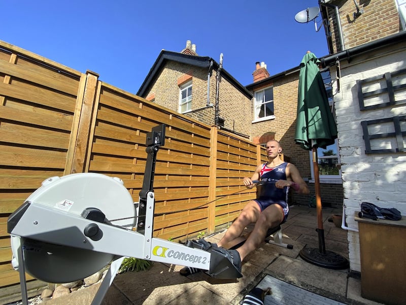 Sbihi using a rowing machine in his back garden to train this year.