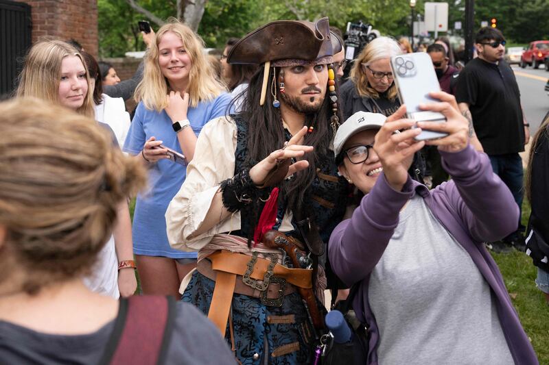 A fan of Depp's dressed as Captain Jack Sparrow poses for a selfie. AFP
