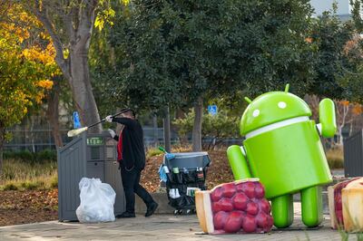 A worker cleans a trash receptacle on the Google campus in Mountain View, California, U.S., on Wednesday, Dec. 16, 2020. On Wednesday, Texas Attorney General Ken Paxton filed an antitrust lawsuit against Alphabet Inc.'s Google. At its center is a bold claim: Google colluded with archrival Facebook Inc. in an illegal deal to manipulate auctions for online advertising, an industry the two companies dominate. Photographer: David Paul Morris/Bloomberg