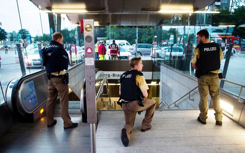 Policemen guard the Georg-Brauchle-Ring underground station close to the Olympia centre where several people were shot dead on July 22, 2016. Lukas Schulze / dpa via AP