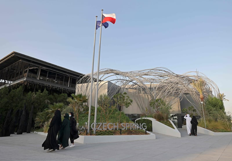 Visitors walk by the Czech Republic pavilion at Expo 2020 Dubai. AFP