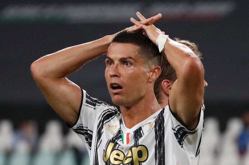 Juventus' Cristiano Ronaldo reacts during the Champions League round of 16 second leg, soccer match between Juventus and Lyon at the Allianz stadium in Turin, Italy, Friday, Aug. 7, 2020. (AP Photo/Antonio Calanni)