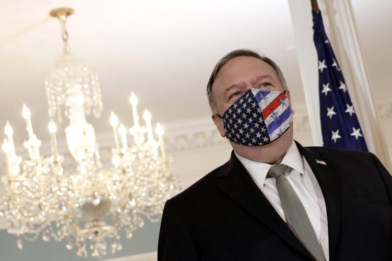 Secretary of State Mike Pompeo wears a face mask before meeting with Romania's Foreign Minister Bogdan Aurescu at the State Department in Washington, Monday, Oct. 19, 2020. (Yuri Gripas/Pool via AP)