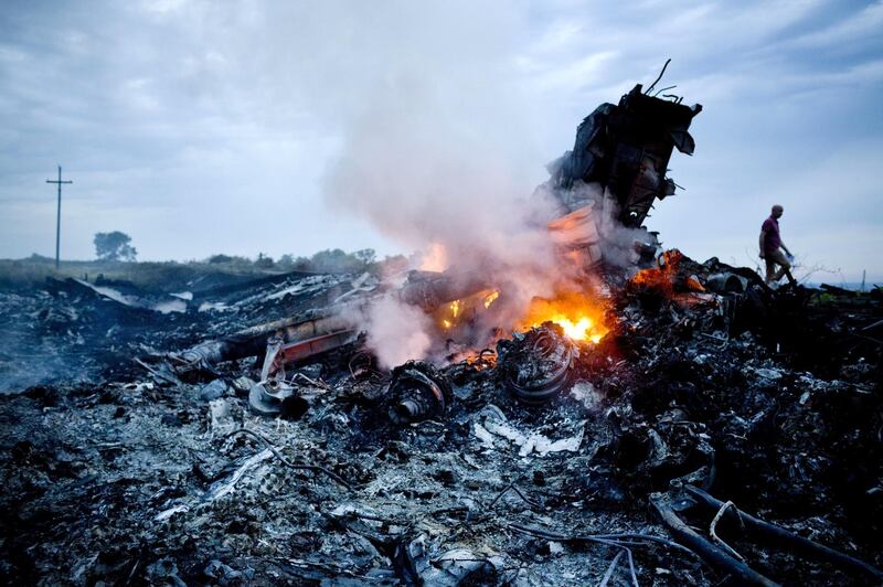 GRABOVO, UKRAINE - JULY 17:   Debris from Malaysia Airlines Flight 17 is shown smouldering in a field  July 17, 2014 in Grabovo, Ukraine near the Russian border. Flight 17, on its way from Amsterdam to Kuala Lumpur and carrying 295 passengers and crew, is believed to have been shot down by a surface-to-air missile, according to U.S. intelligence officials and Ukrainian authorities quoted in published reports. The area is under control of pro-Russian militias.  (Photo by Pierre Crom/Getty Images)