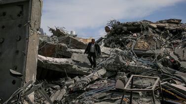 A man walks over in Khan Younis, southern Gaza. At least 14 people were killed when Israeli forces opened fire on a crowd waiting for aid. EPA