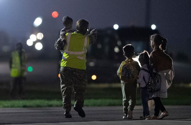 People flown out of Kabul on a British Royal Air Force plane arrive at the RAF Brize Norton airbase in southern England. AFP