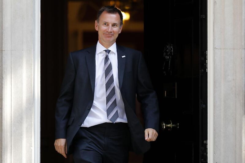 (FILES) In this file photo taken on July 3, 2018 Britain's Health and Social Care Secretary Jeremy Hunt leaves 10 Downing Street in central London after attending the weekly cabinet meeting.  Jeremy Hunt has been named as Britain's Foreign secretary on July 9, 2018 following the resignation of Boris Johnson. / AFP / Tolga AKMEN
