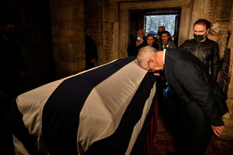 Members of the public pay their respects to the former king in Athens. AFP