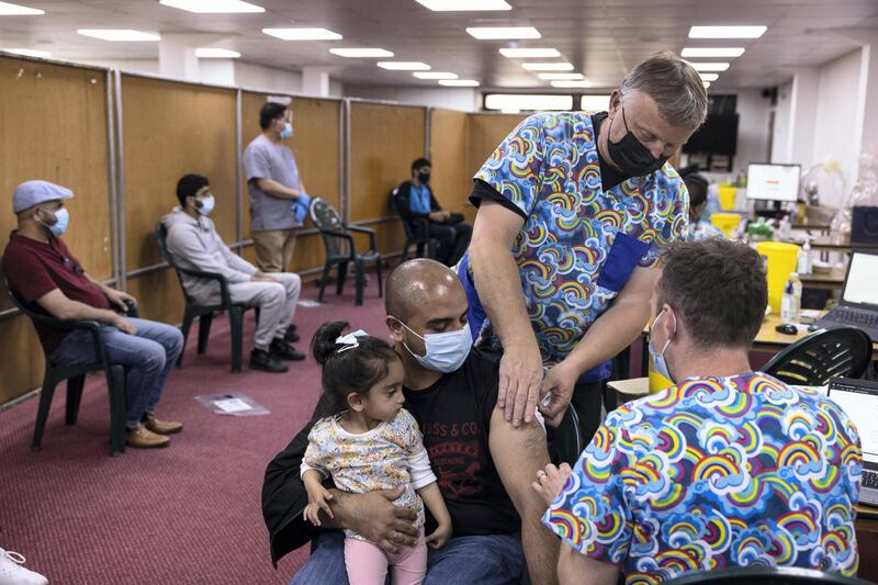 LONDON, ENGLAND - JUNE 08: Members of the public have the Astrazeneca Covid-19 vaccination at Fazl Mosque in Southfields as they host a drop in clinic on June 08, 2021 in London, England. More than 76% of adults in the UK have had their first dose of a Covid-19 vaccine, and just over half - or about 27 million people - are fully vaccinated. (Photo by Dan Kitwood/Getty Images)