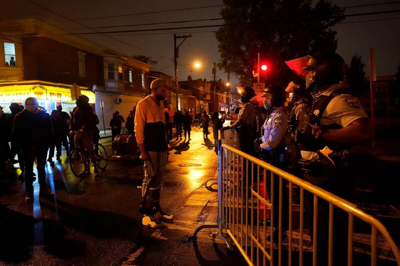 People gather in protest in response to the police shooting of Walter Wallace Jr. in Philadelphia. AP