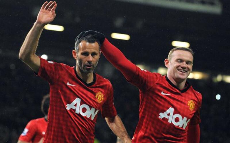 Wayne Rooney said he really wanted to impress Ryan Giggs when he joined Manchester United from Everton in 2004. AFP