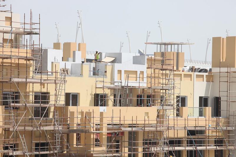 Weak demand in the market was prompting property developers to slow down construction and complete fewer homes than predicted. Jeffrey E Biteng / The National