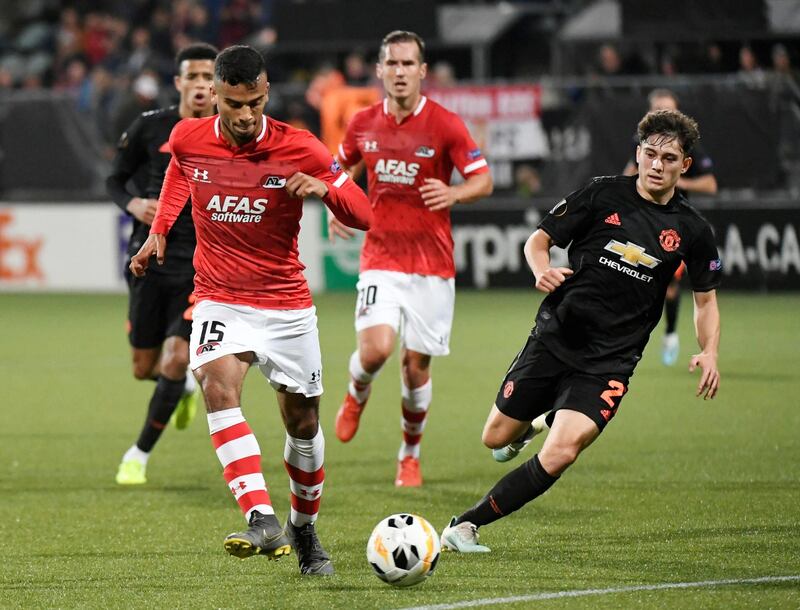 AZ Alkmaar's Owen Wijndal battles with United's Daniel James. Reuters