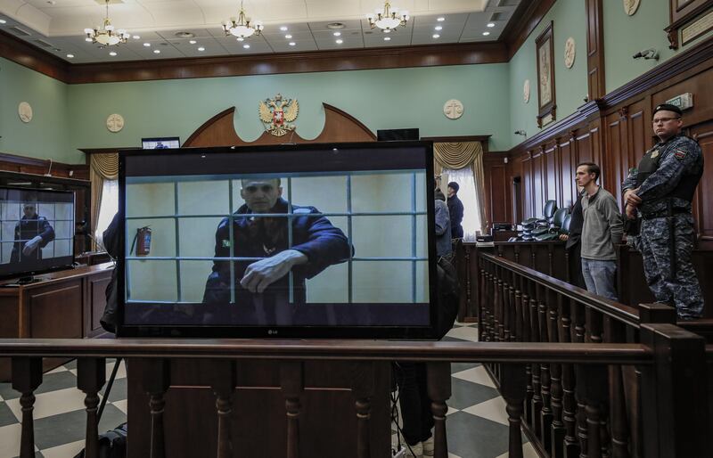 Russian opposition leader Alexei Navalny appears by videolink at a Moscow hearing at which he had a nine-year sentence in a penal colony for fraud and insulting a court upheld. EPA